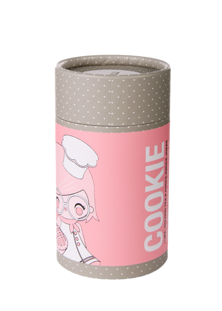 Gray cylindrical Cookie box with white polka dots, pink label, and a kawaii Momiji doll chef character illustration on the front. — Momiji doll
