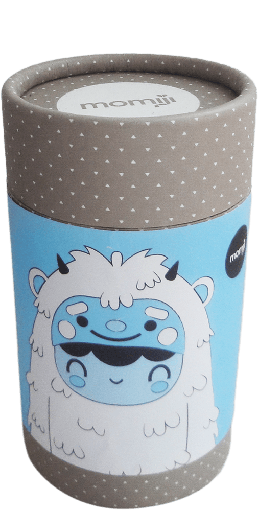 Snug Bug HN Momiji doll in a blue-labeled cylinder with cartoon yeti, gray lid, and Momiji branding; message inside. — Momiji doll