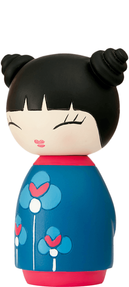Hurray Momiji doll with black hair in twin buns, closed eyes, and a blue dress adorned with white floral patterns. — Momiji doll