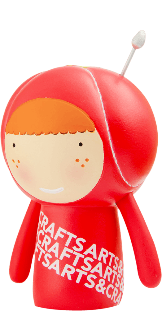 Cherie Momiji doll: red, smiling face, orange hair, "ARTS&CRAFTS" text on body, pin detail; hides a secret message inside. — Momiji doll