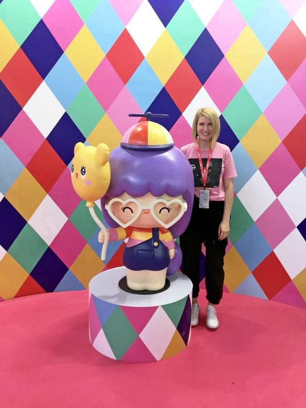 A Momiji Designer posing with a life size Momiji Doll