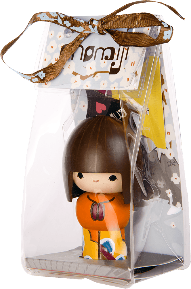 Rainbows Momiji doll with brown hair and orange outfit, in a clear bag tied with a brown ribbon. — Momiji doll