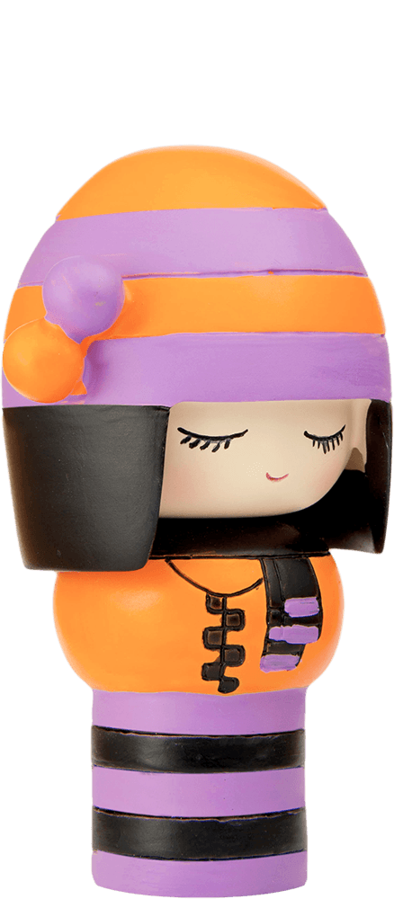Clever Clogs Momiji doll with closed eyes, orange and purple striped outfit, and a black helmet-style hat. — Momiji doll