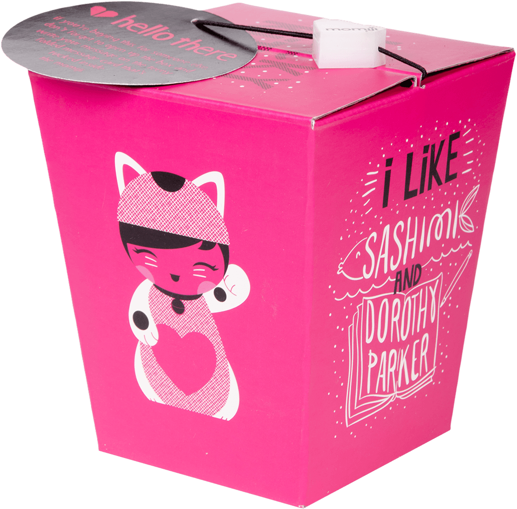 The Lucky Kitty Momiji doll features a bright pink takeout box with a cute cat illustration and signature secret message inside. — Momiji doll