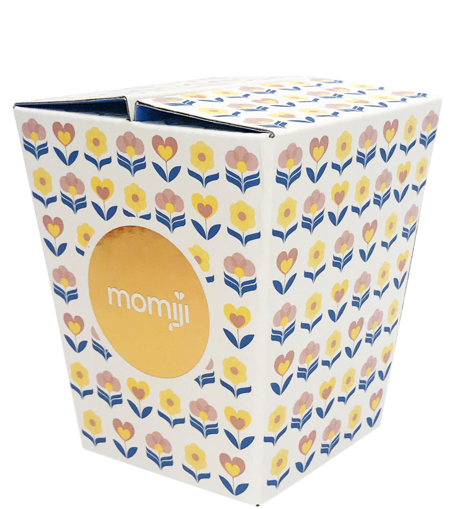 A kawaii white Momiji doll box with pink, blue, and yellow flowers, featuring a yellow circle labeled Janis J. — Momiji doll