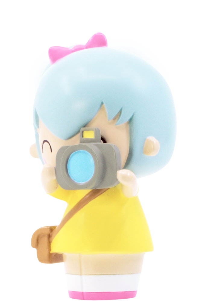 Pixie Pixel HN Momiji doll: blue hair, yellow dress, pink bow, camera, and bag. Collectible with hidden message inside. — Momiji doll