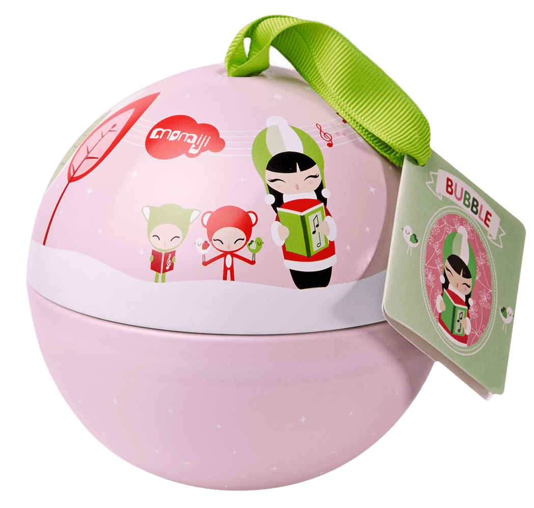 Pink round gift container with cartoon carolers, green ribbon, and a tag showing Bubble Momiji doll singing. — Momiji doll