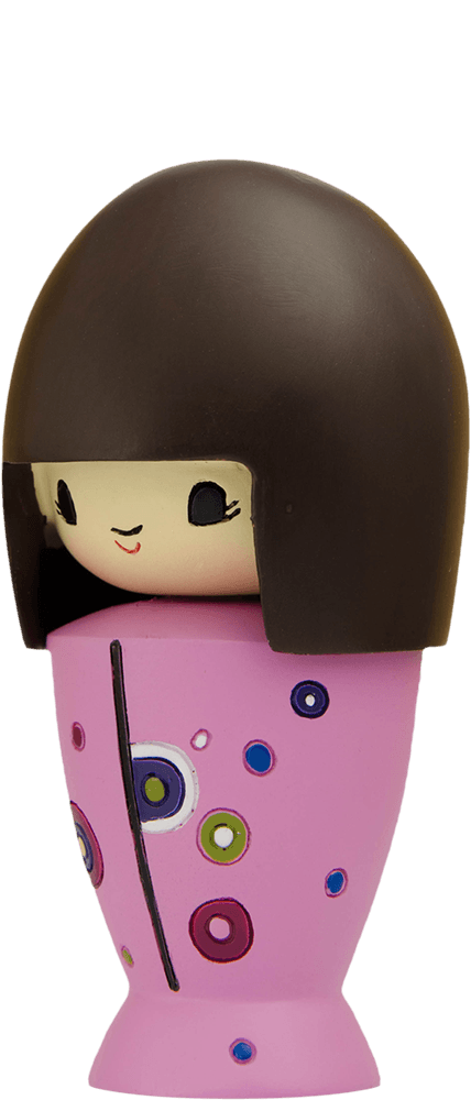 The Very Big Birthday Momiji doll has a brown bob, a pink dress with colorful circles, and hides a secret message inside. — Momiji doll