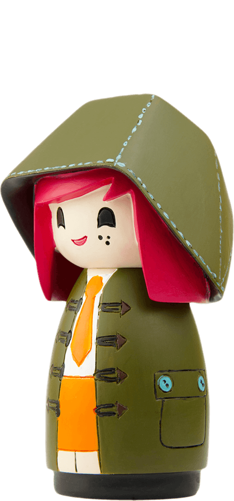 Mabel Momiji doll with red hair, green hooded coat, orange tie, skirt, and rosy cheeks. Cute collectible with secret message. — Momiji doll