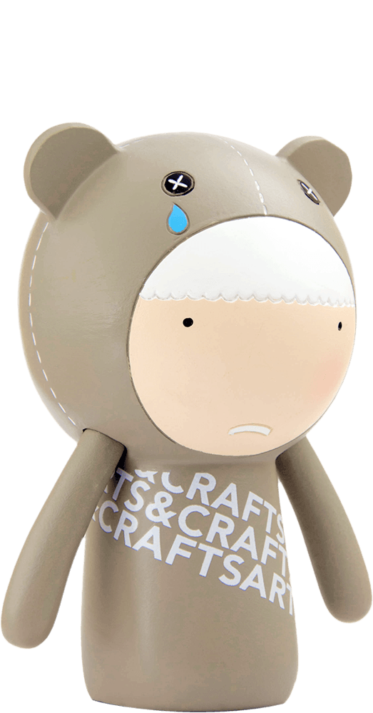 Ted Momiji doll: cartoon bear with X eyes, a teardrop, “CRAFTS & ARTS” on chest; inspired by Tokyo and Seoul street style. — Momiji doll