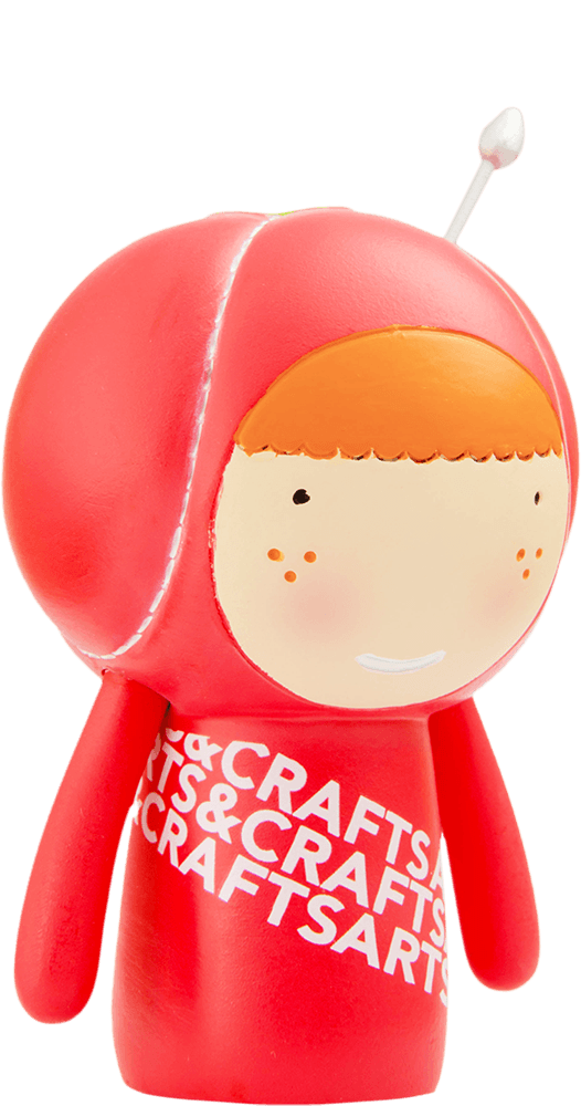 Cherie Momiji doll: red body, orange hair, antenna, smiling face, "ARTS & CRAFTS" text. Kawaii collectible with a hidden message. — Momiji doll
