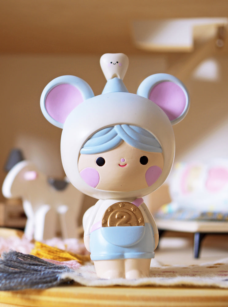 The Tooth Mouse Momiji doll has blue hair, mouse ears, a tooth hat, and holds a gold coin marked "2" in a cozy room. — Momiji doll
